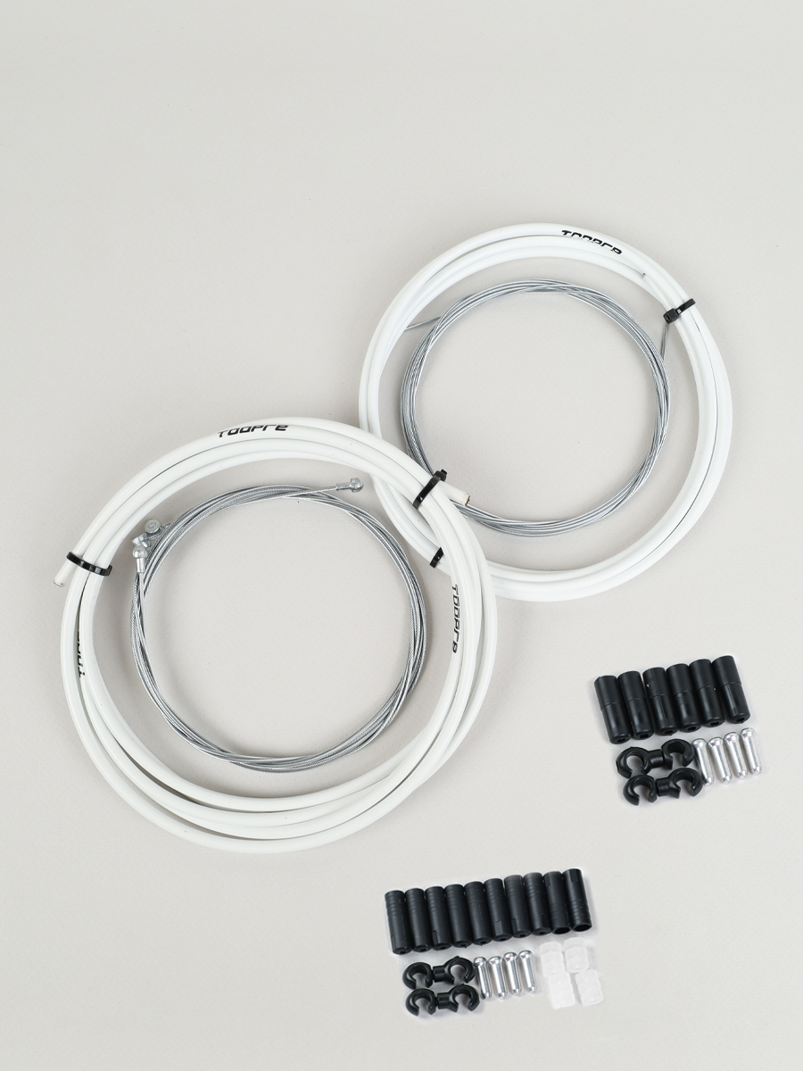 Комплект оплетки и тросов велосипеда. Переключение+тормоза.  2 Оплетки/4 троса/наконечники/зажимы. TOOPRE BSCS-02. белый/уп 50/